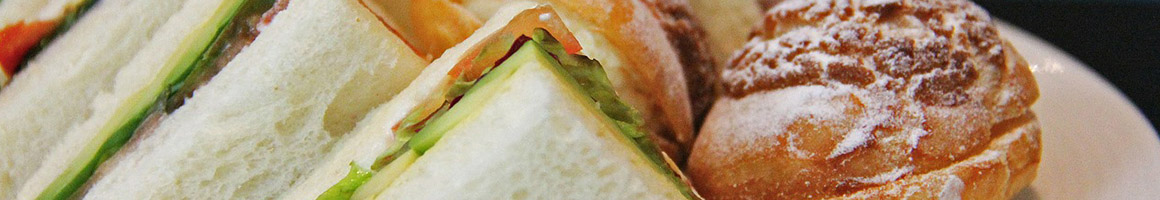 Eating Sandwich at Bagels' Best restaurant in Needham, MA.